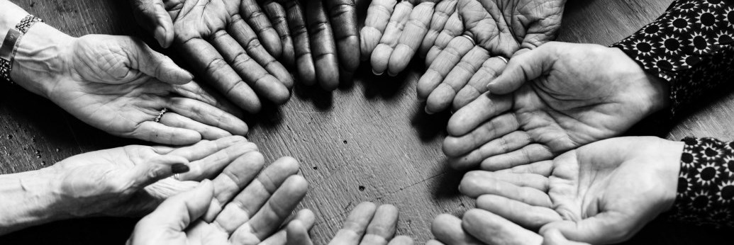 Black and white elderly hands