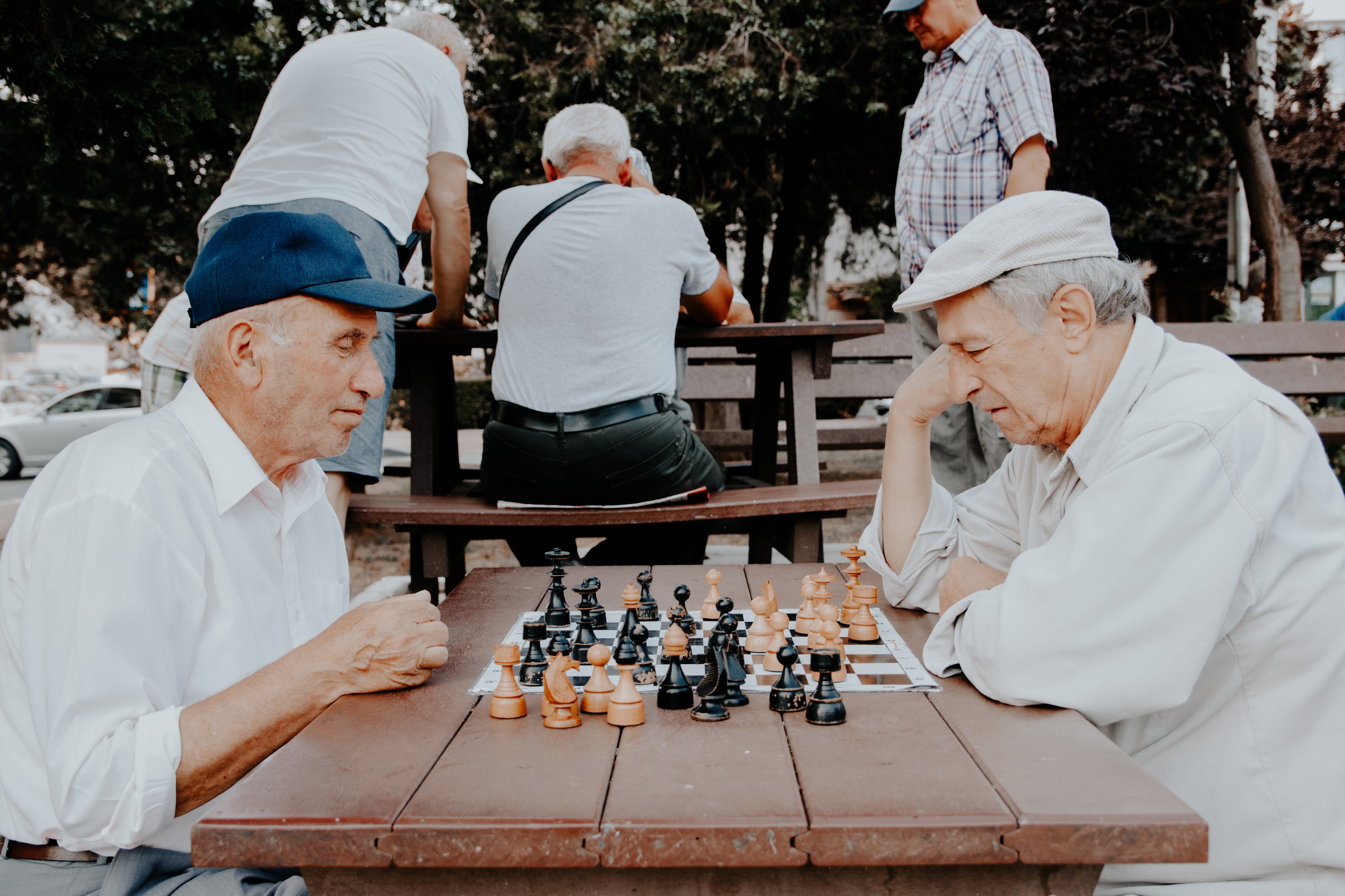 two elderly man playing chess